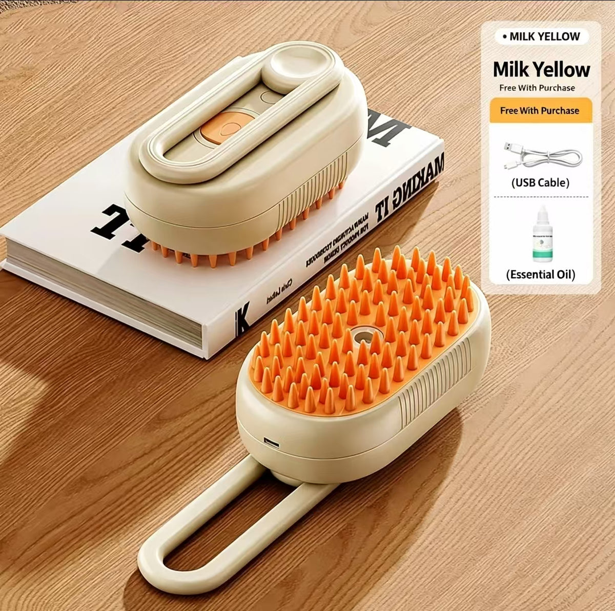 A handheld pet grooming brush in a warm cream color with bright orange bristles, shown on a wooden tabletop next to a book and a promotional overlay detailing a free milk yellow set with a USB cable and essential oil.