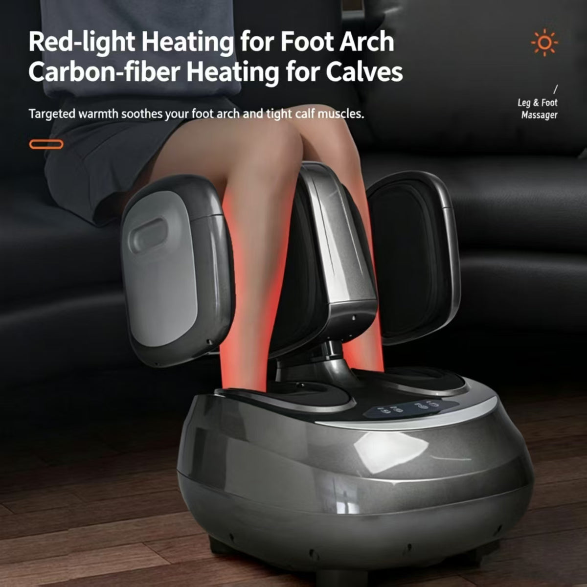 A gray and black leg and foot massager shown in use with a person's legs inside the device, sitting on a wooden floor in front of a black leather sofa. Text on the top left reads 'Red-light Heating for Foot Arch Carbon-fiber Heating for Calves' and 'Targeted warmth soothes your foot arch and tight calf muscles.