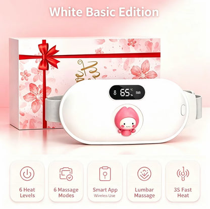 White basic edition wireless lumbar massage device shown in front of its pink floral gift box with a red ribbon. The device has a digital temperature display showing 65 degrees Celsius and a cartoon character on the front.