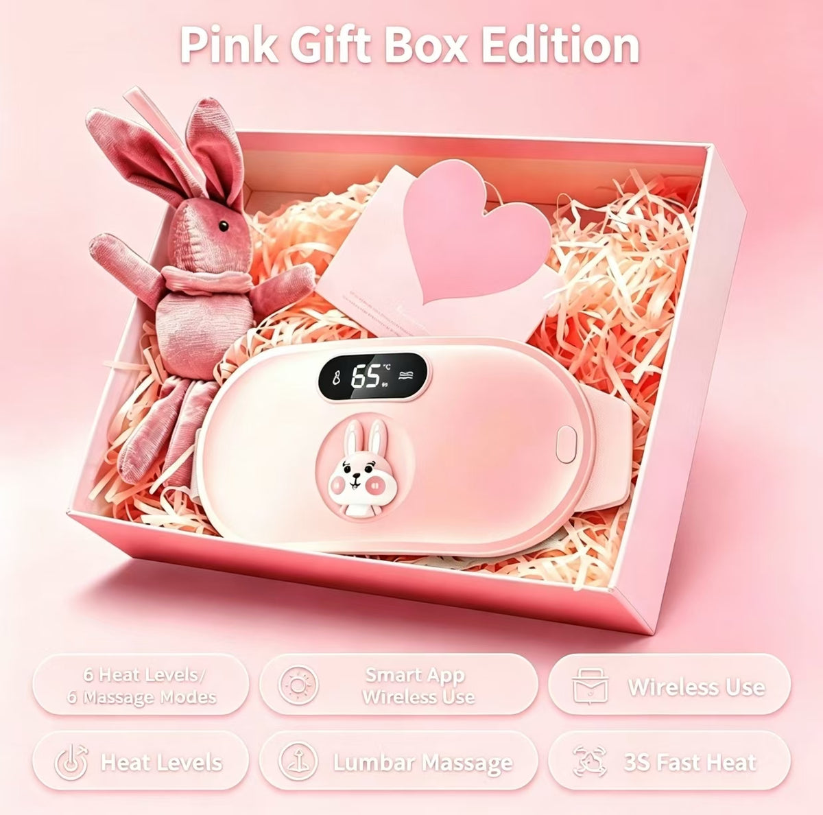 Pink gift box edition featuring a pink heated lumbar massage device with a bunny face graphic, displayed inside a pink gift box with shredded paper, a plush bunny, and a heart card. Text overlays describe the features and edition.