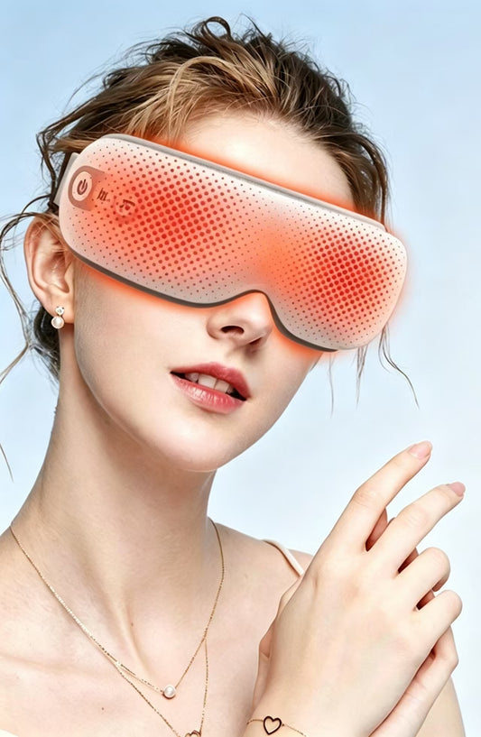 A woman wearing a pink and orange heated eye mask against a light blue background.