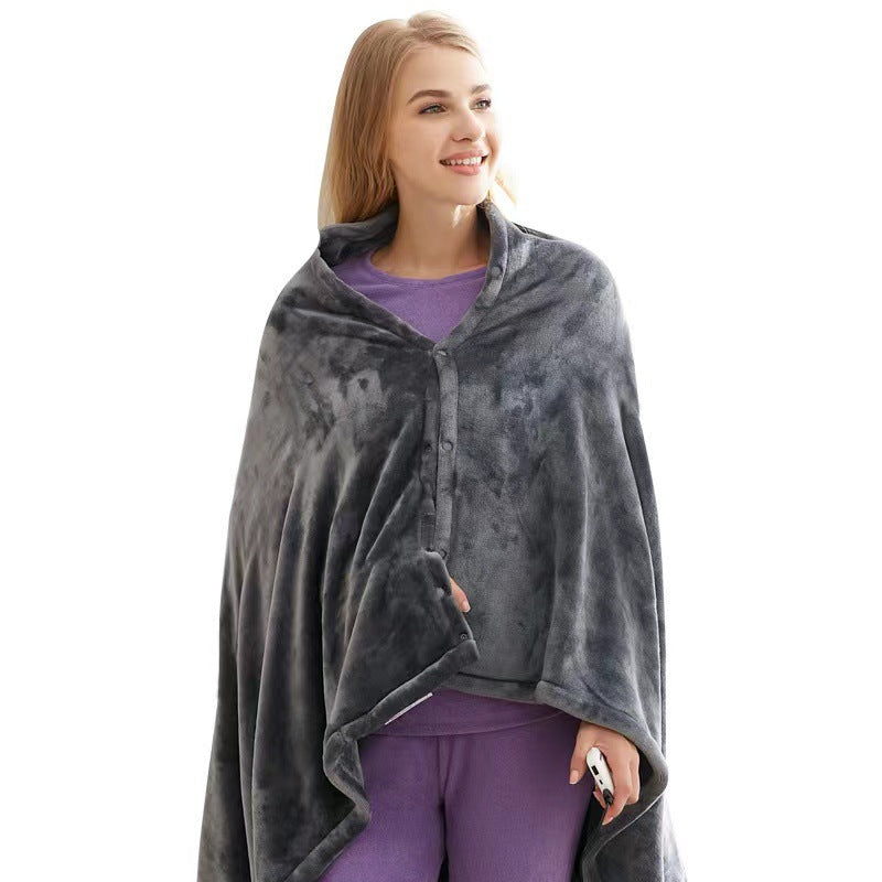 Woman wearing a gray poncho over a purple outfit on a white background