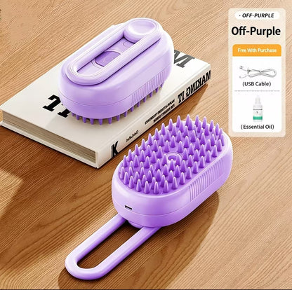 Two lavender pet grooming brushes arranged on a wooden surface, with one brush resting on a book and the other in the foreground. A promotional panel on the right reads 'Off-Purple' and lists a USB cable and essential oil included with purchase.