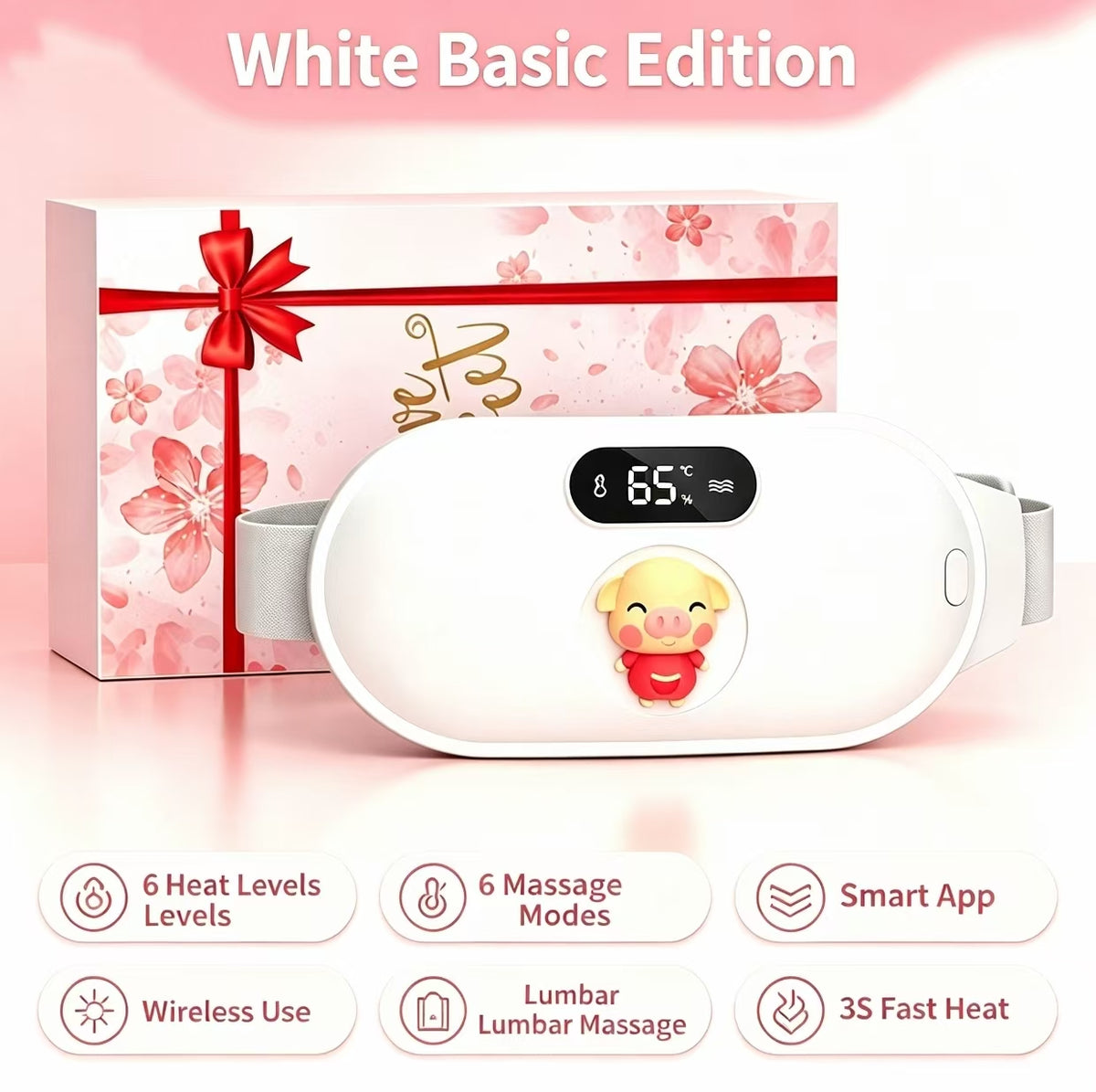 White basic edition lumbar massage device shown in front of its pink gift box with a red ribbon. The device has a digital temperature display showing 65 degrees Celsius and a cartoon character graphic.