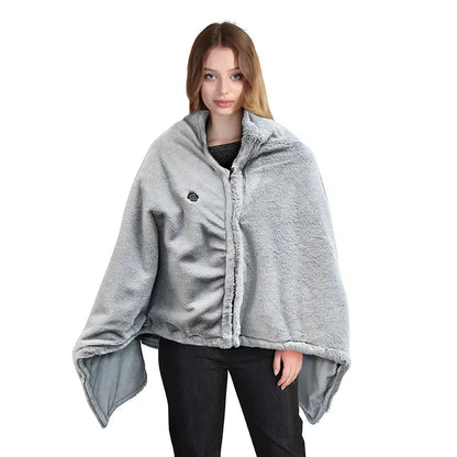 A woman wearing a light gray fleece poncho-style blanket with a hood and a small circular control button on the chest, shown against a plain white background.